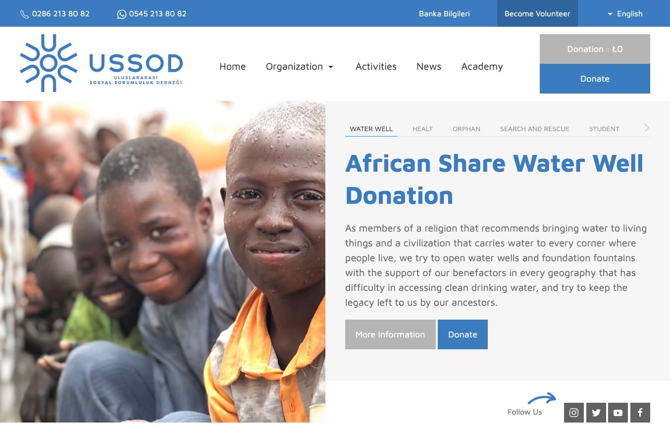 USSOD English homepage: a water well donation campaign with a photo of smiling children and a donate button